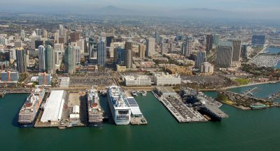 From left to right are Holland America’s Westerdam and Zuiderdam, and Princess Cruises Grand Princess. On the right is the USS Midway.