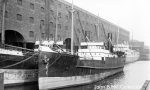 The 919grt Gloucester Coast was built in 1913 by George Brown & Co. at Greenock as the Sir Walter Bacon for Powell, Bacon & Hough Lines. She became Gloucester Coast in 1913. In 1936 she joined Bristol Steam Navigation Co. as Alecto. On 2nd May 1937 she sank after colliding in fog with the 2,745grt Jugoslavian freighter Plavnik off the North Hinder Light Vessel. Moored next to her is the 672grt Dorset Coast which was built in 1908 by Harkess at Middlesbrough. In 1915 she was sold to T.C. Steven & Co. and renamed Arbonne. On 26th February 1916 she was torpedoed and sunk by UB-2 in the mouth of the Thames with the loss of all hands. John B. Hill collection